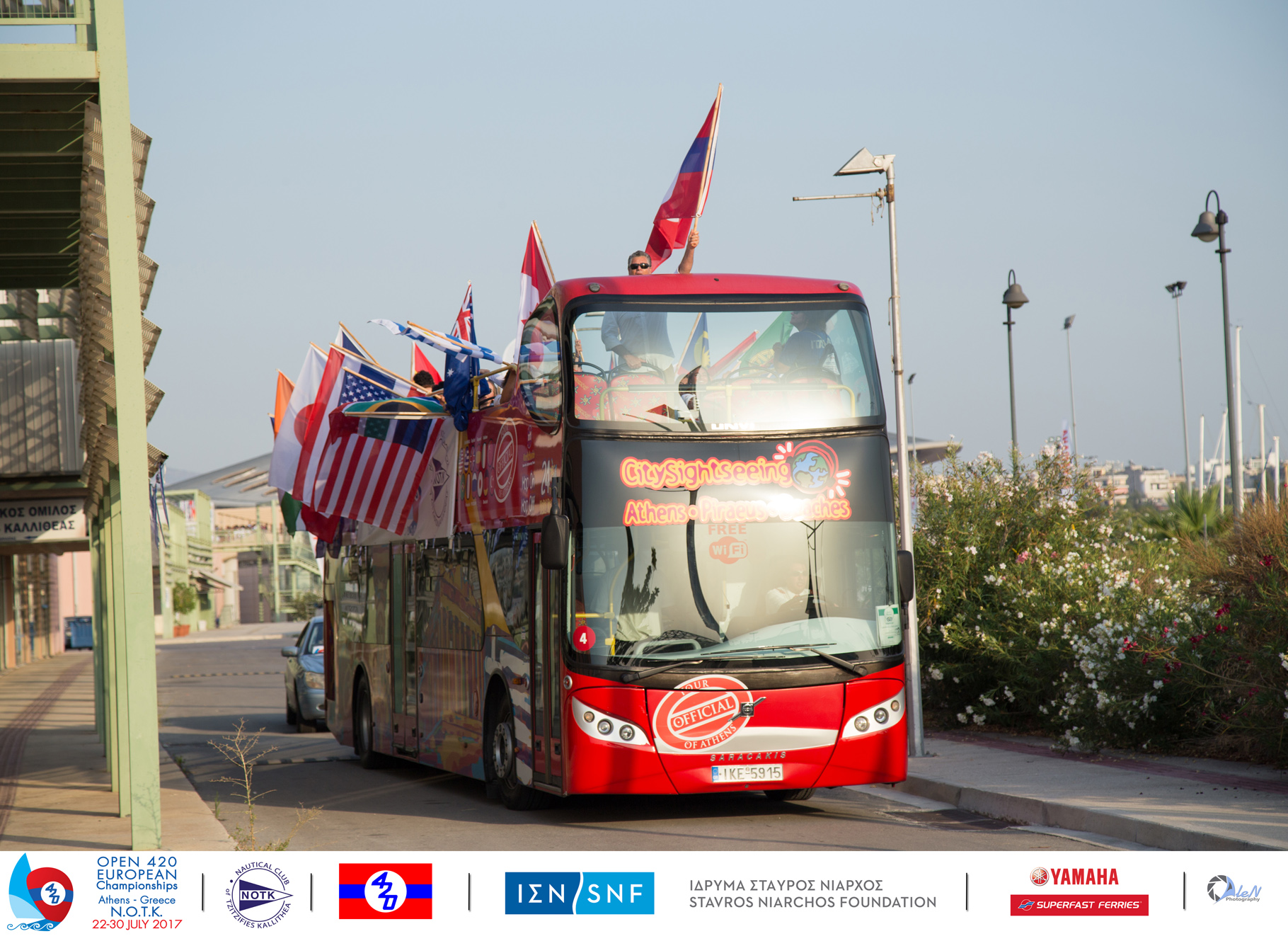 National Flags waving on open top bus